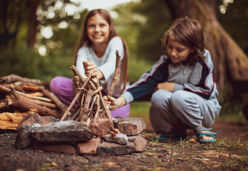 Children Lighting camp fire